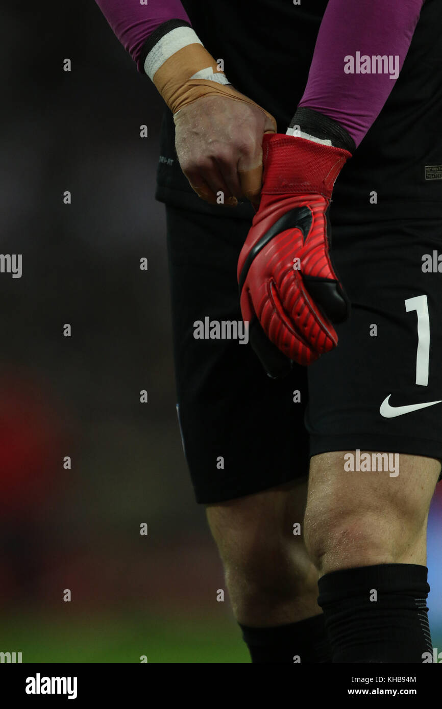 Joe Hart goalkeeper of England pulls on his Nike goalkeeping gloves at the  England v Brazil international friendly match at Wembley Stadium, London,  on November 14, 2017. ** This picture is for