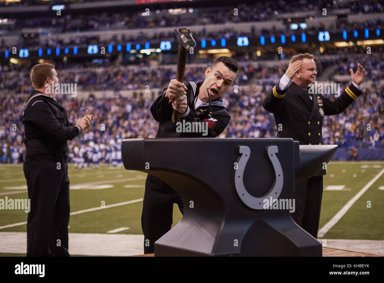 Indianapolis, Indiana, USA. 12th Nov, 2017. November 12th, 2017 - Indianapolis, Indiana, U.S. - A member of the U.S. Navy hits a large Indianapolis Colts anvil with a sledge hammer before an NFL Football game between the Pittsburgh Steelers and the Indianapolis Colts at Lucas Oil Stadium. Credit: Adam Lacy/ZUMA Wire/Alamy Live News Stock Photo