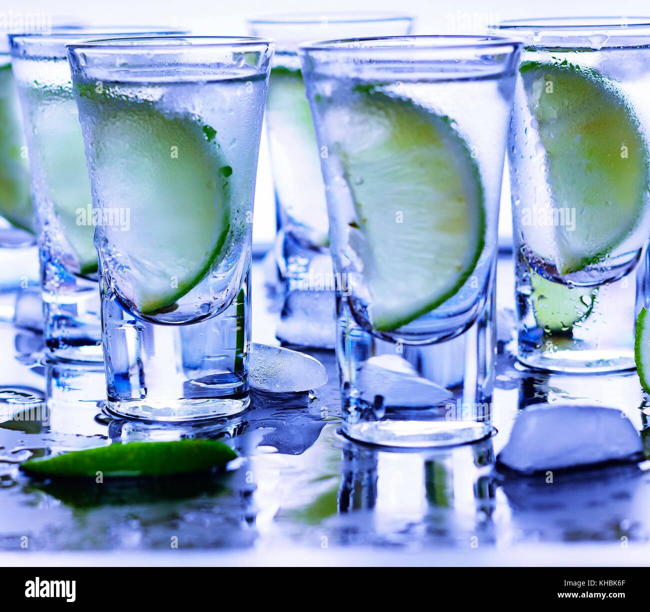 Closeup vodka in a glass with ice, lime vodka, Gin, tonic, tequila