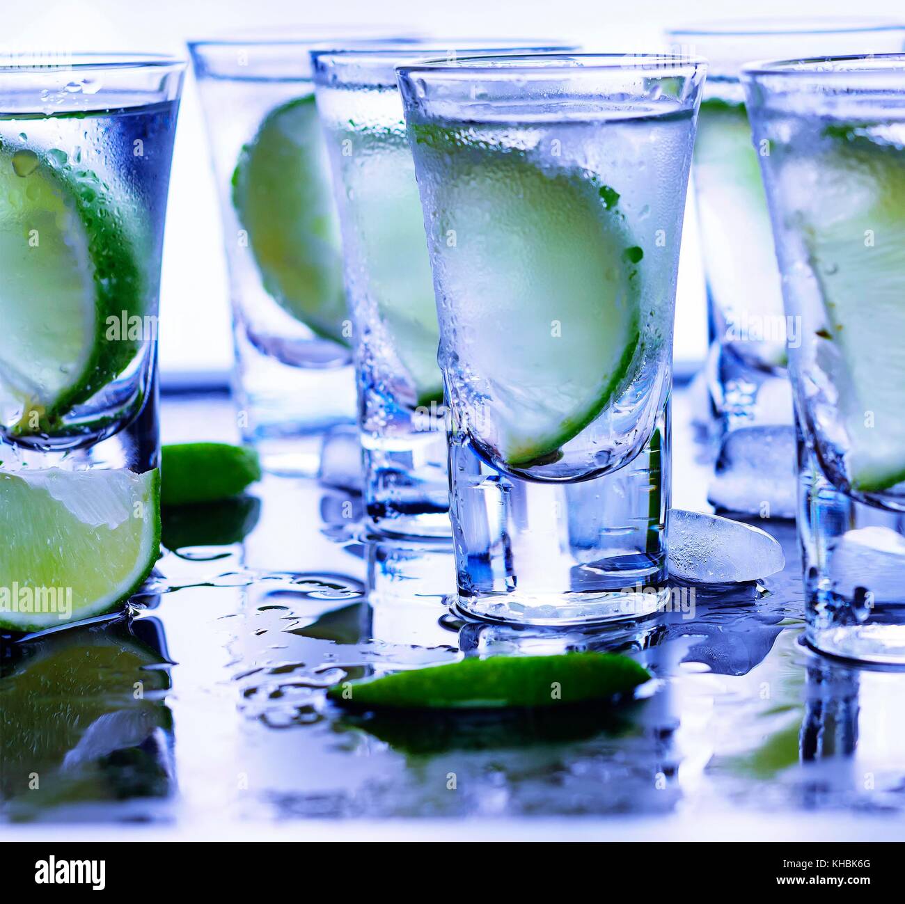 Closeup vodka in a glass with ice, lime vodka, Gin, tonic, tequila