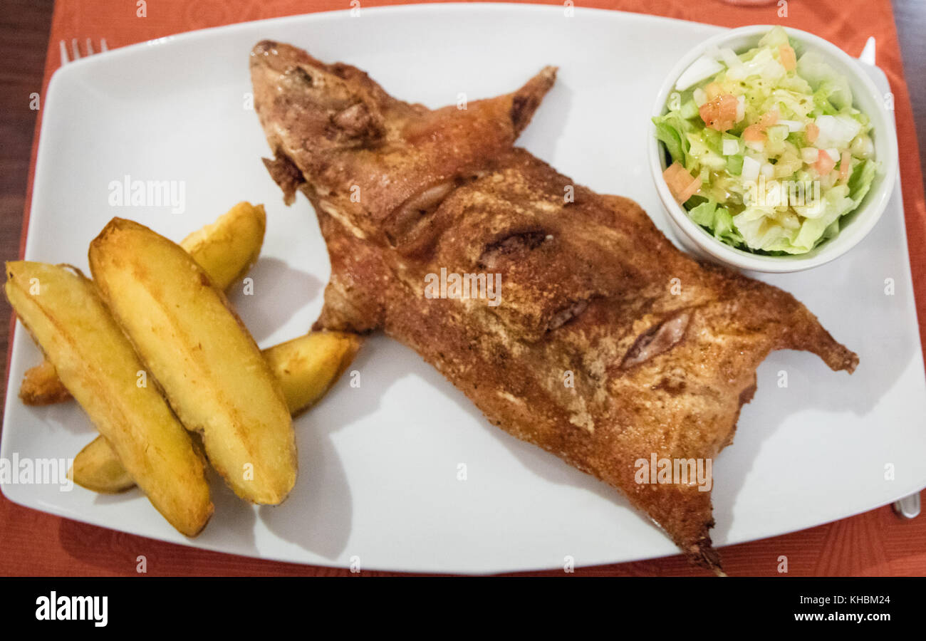 Cuy  ( cooked Guinea pig), typical andean dish Stock Photo