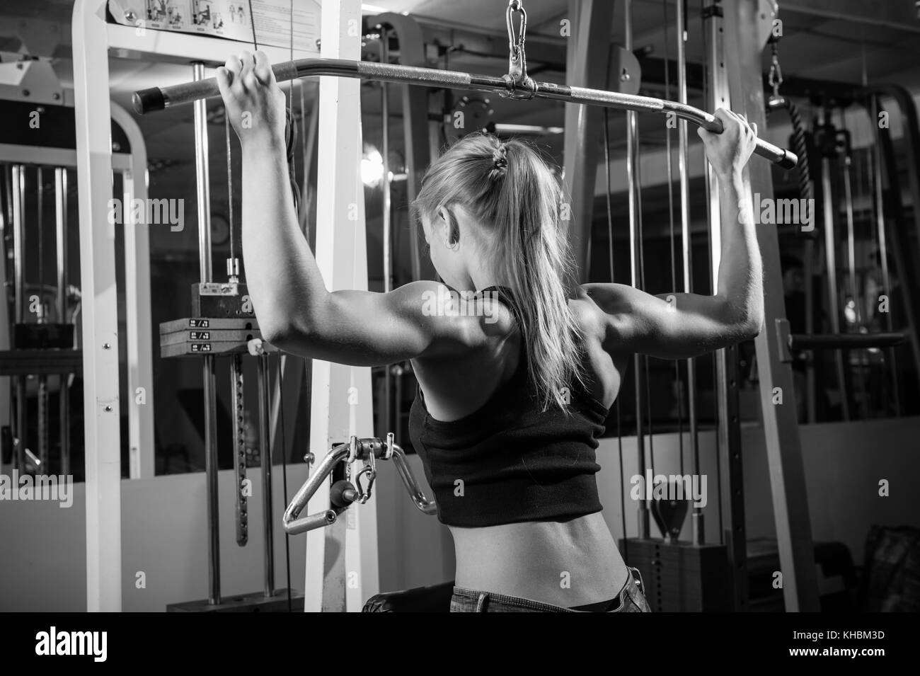 Young muscular woman doing workout Stock Photo