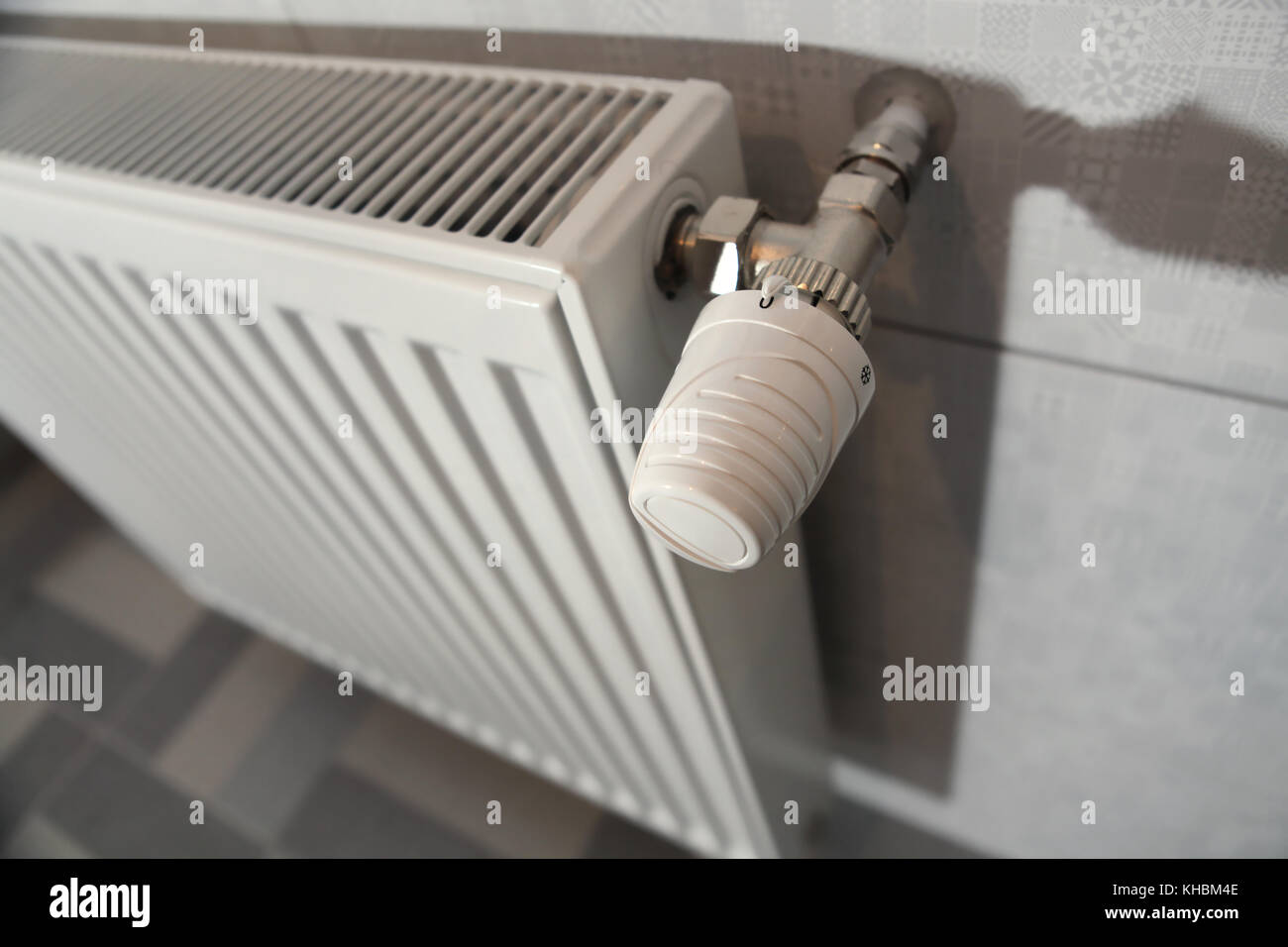 white heating radiator under in the room Stock Photo - Alamy