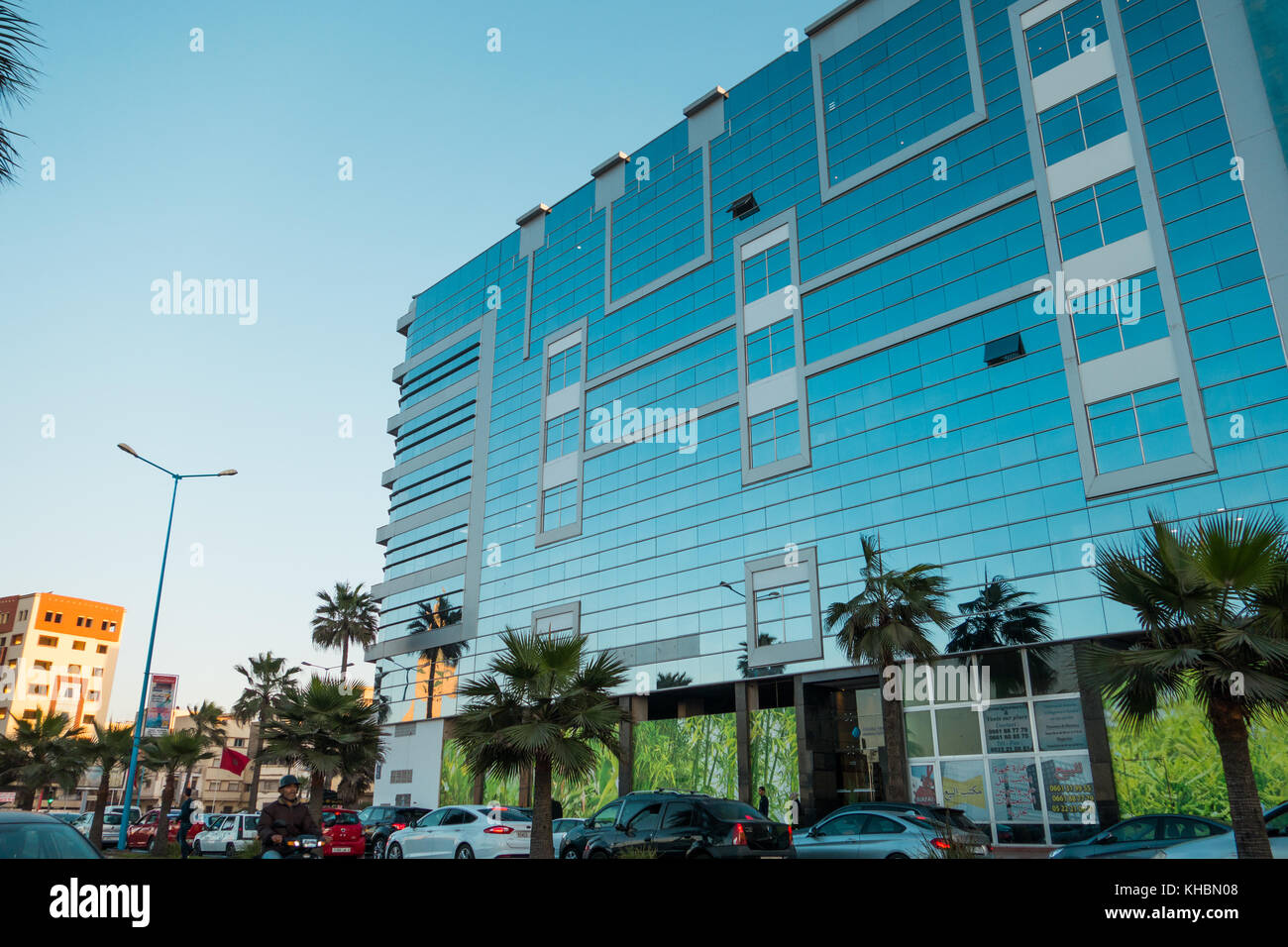 Casablanca, Morocco - November 7, 2017 : Low angle view of a modern shiny building and cars Stock Photo