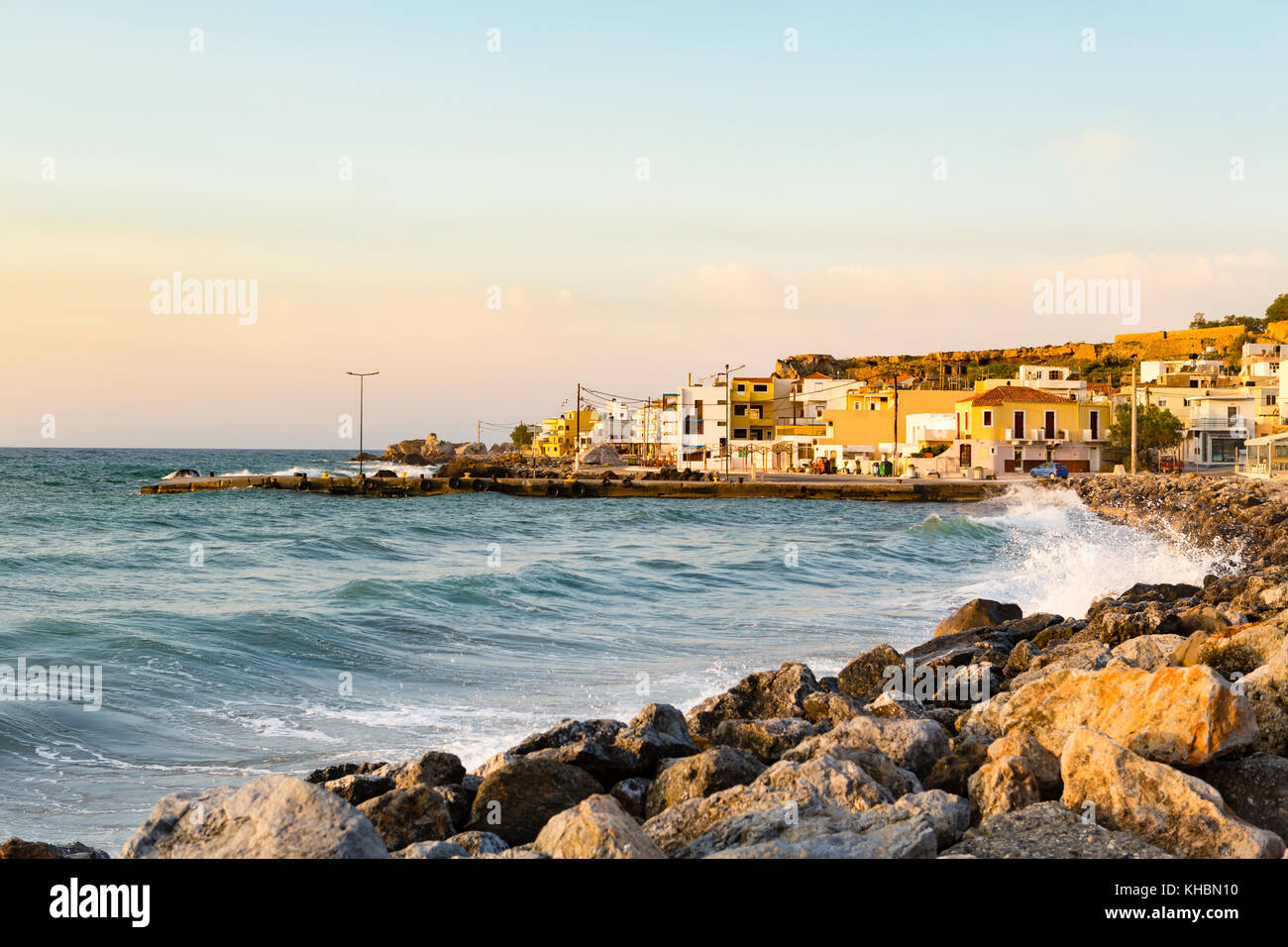 Inspirational beautiful sunrise in mediterranean town with sea, coast, beach and rocks. City of Paleochora, Crete Island, Greece. Stock Photo