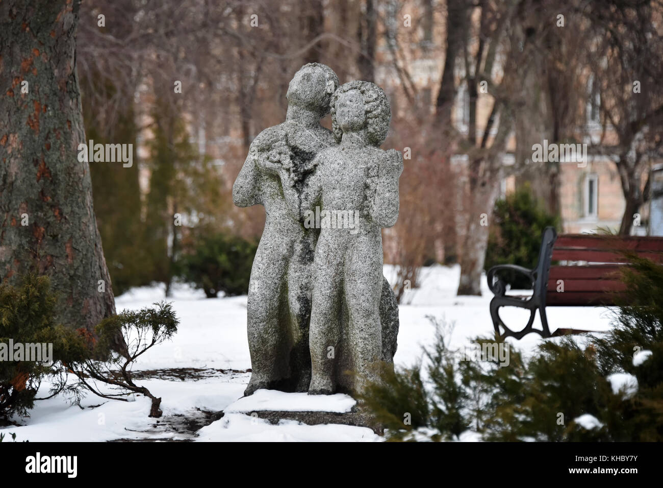 Sculptures of lovers, man and woman in winter park, Kyiv, Ukraine