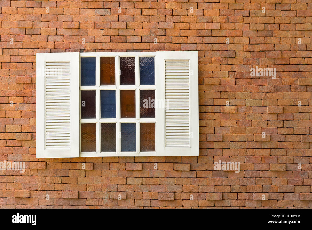 Old red brick wall with white window Stock Photo - Alamy
