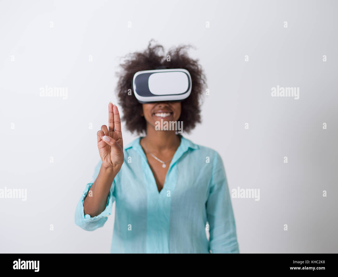 Happy african american girl getting experience using VR headset glasses ...