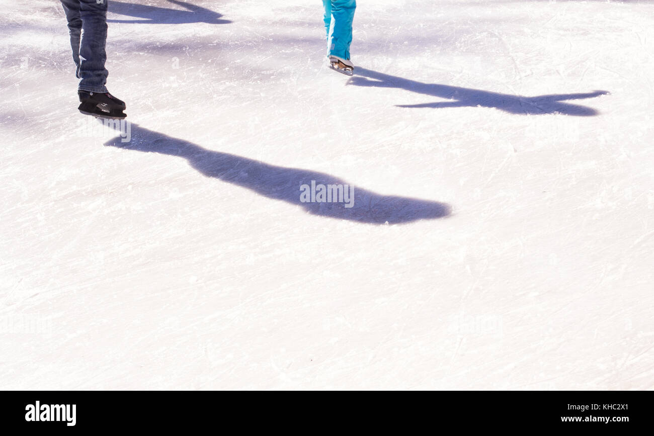 Shadows of skaters on ice rink Stock Photo