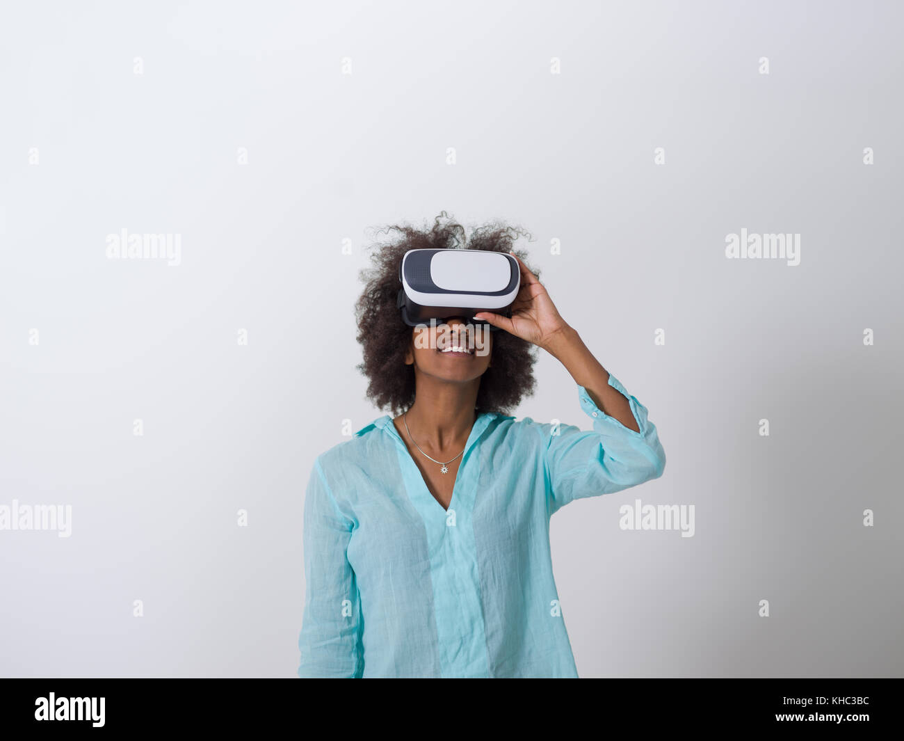 Happy african american girl getting experience using VR headset glasses ...