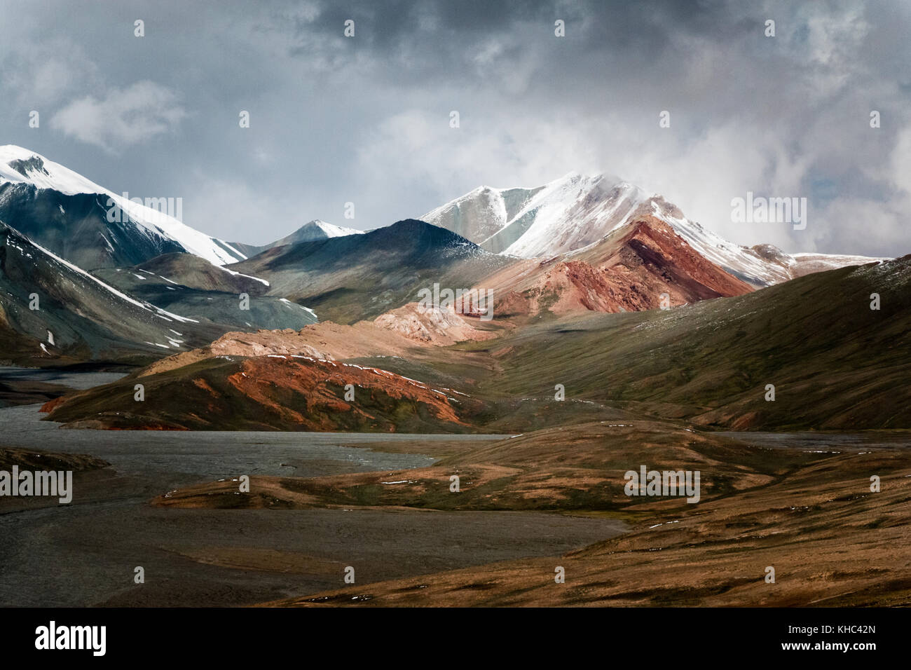 Colored moutains covered by snow, Kyzylart Pass, Tajikistan Stock Photo