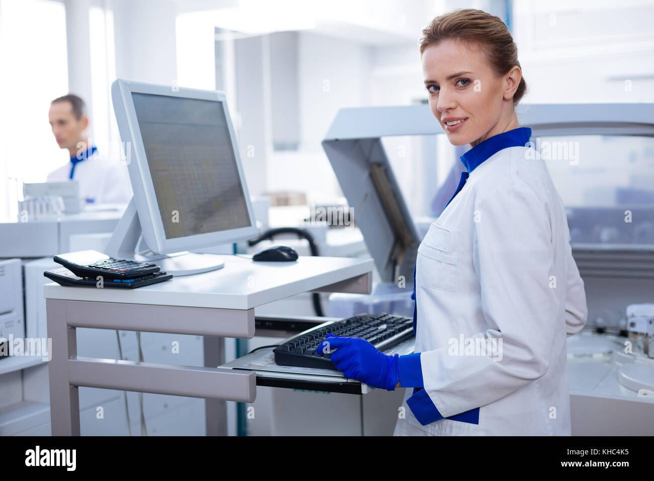 Gorgeous intelligent scientist testing the samples  Stock Photo