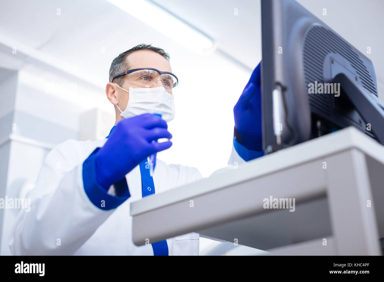 Tranquil earnest scientist exiting about his discovery Stock Photo