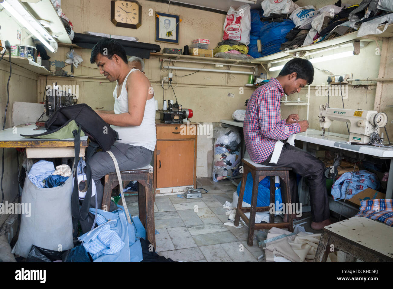 Tailors working at their sewing machines in Mumbai, India Stock Photo