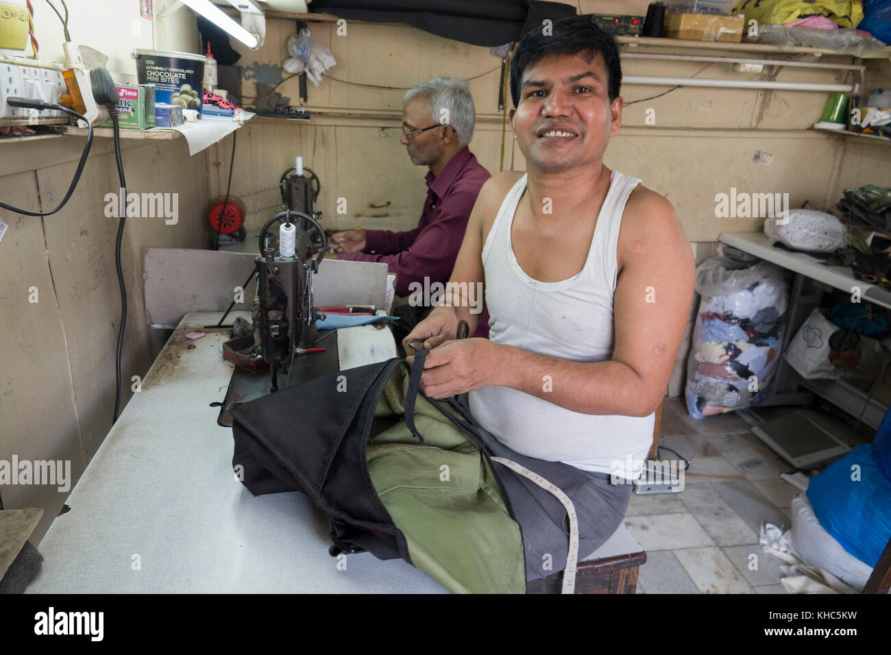 Tailors working at their sewing machines in Mumbai, India Stock Photo