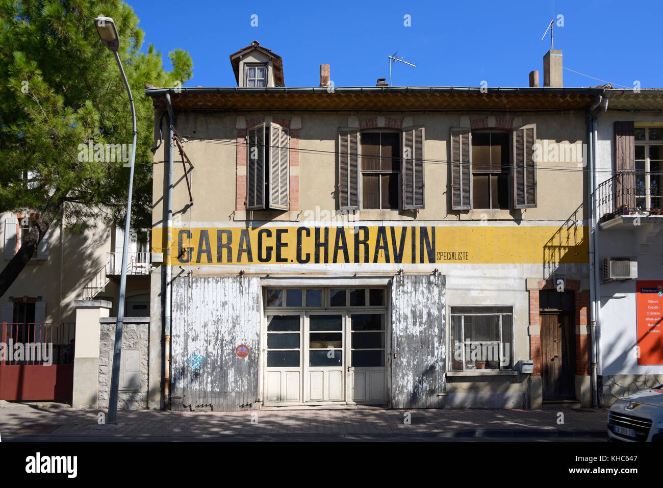 Abandoned, Vacant or Closed Automobile Repair Shop, Workshop, Local Garage, or Small Business, Vaison-la-Romaine, Vaucluse, Provence, France Stock Photo