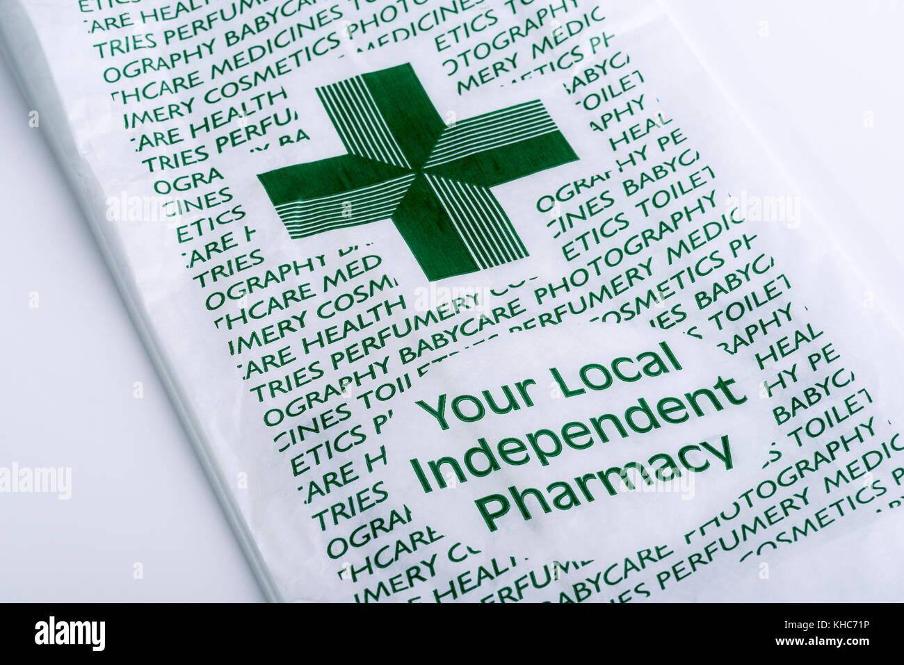 Your local independent pharmacy, paper bag, green cross. Stock Photo