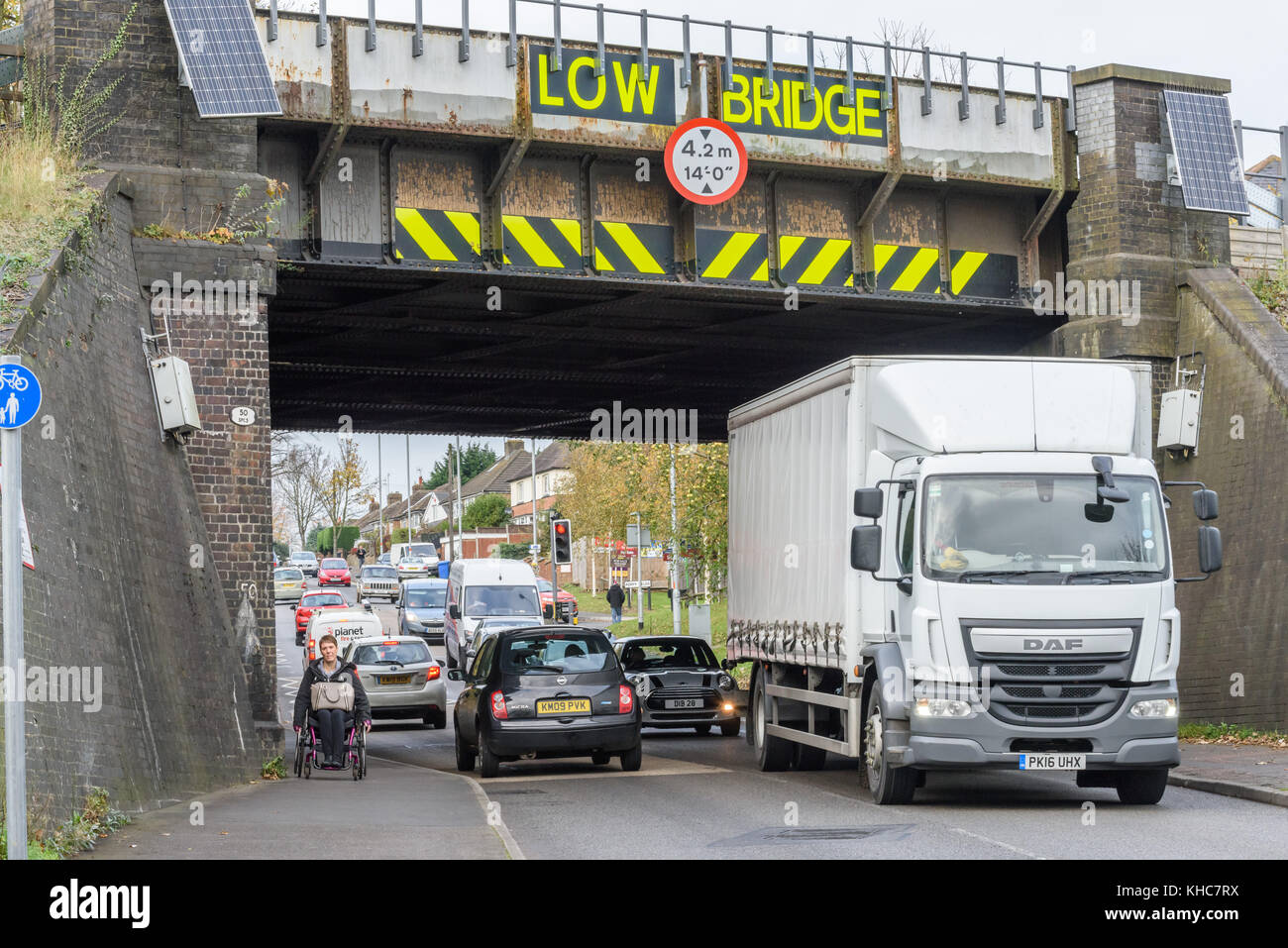 Low railway bridge on the A4300 Rothwell road at Kettering, England. Stock Photo
