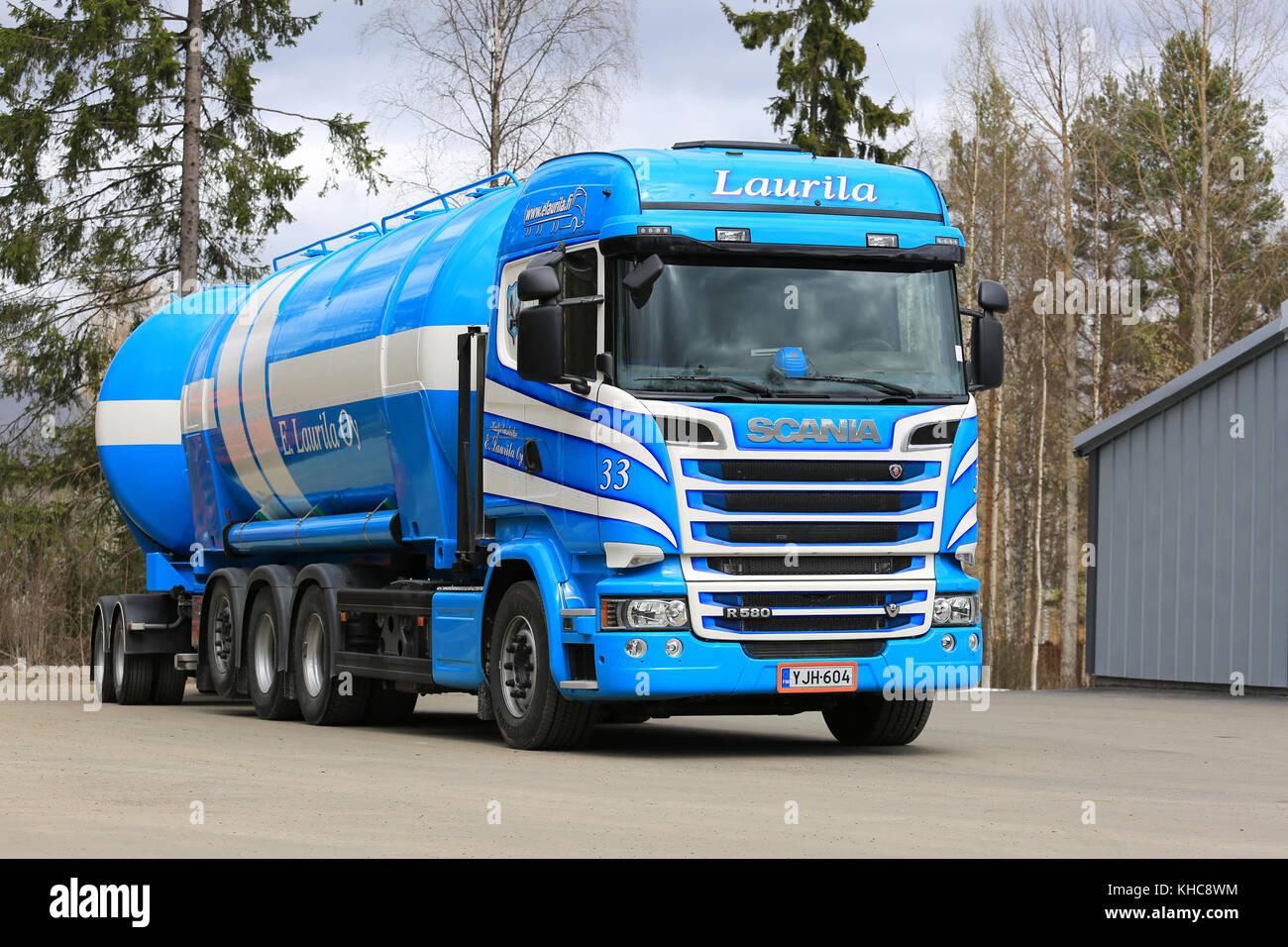 AANEKOSKI, FINLAND - MAY 20, 2017: Blue and white Scania R580 tanker of E Laurila Oy parked on truck stop asphalt yard at spring. Stock Photo