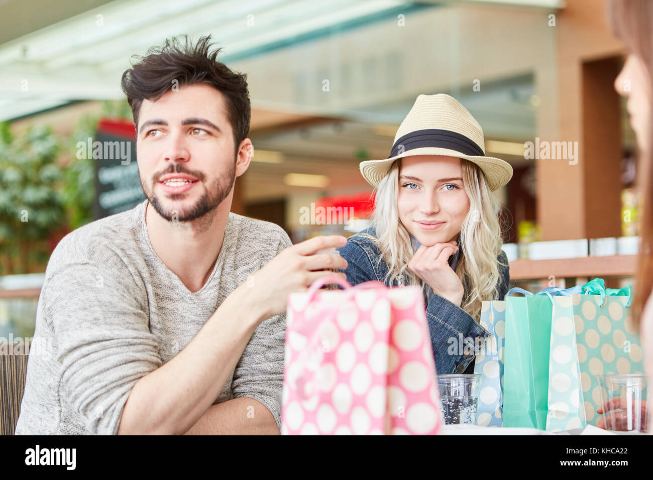 Group of relaxed teenagers in a shopping break at the mall Stock Photo