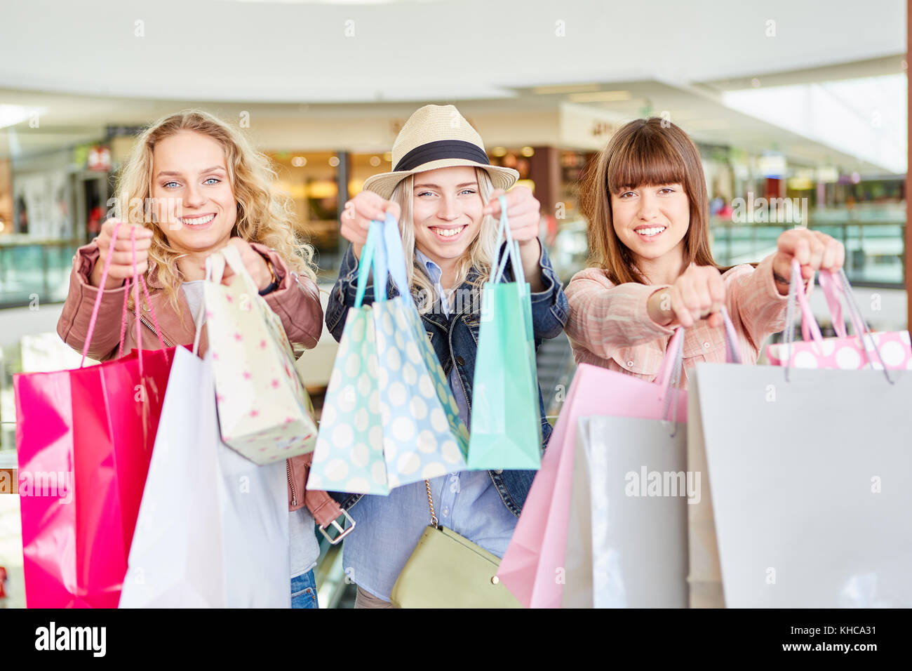 Young women shopping at the mall with many shopping bags Stock Photo