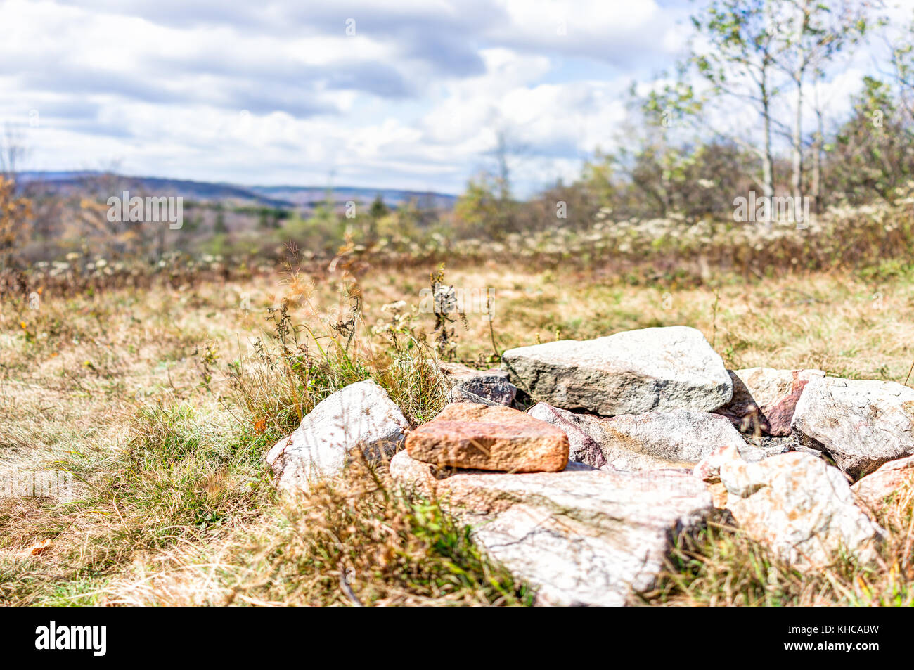 Closeup of fire pit on backpacking campsite made of rocks and stones in meadow field in Dolly Sods, West Virginia Stock Photo