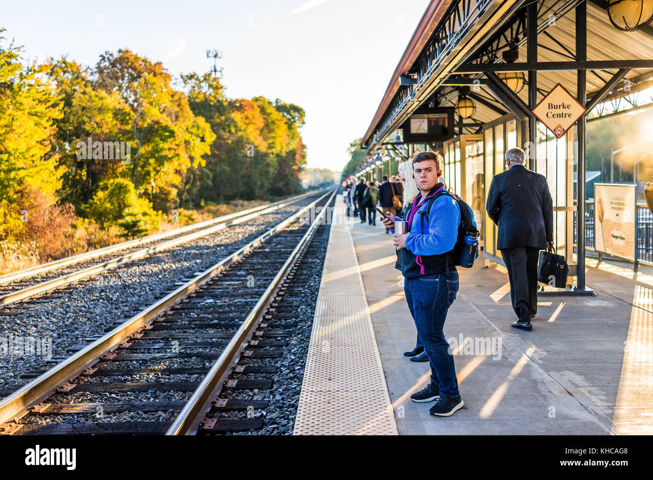 Burke, USA October 27, 2017 Young man waiting on platform for VRE