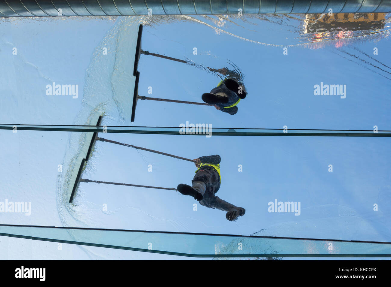 Workers clearing water with squeegees on lower deck of SS Great Britain, Great Western Dockyard, Spike Island, Bristol, England, United Kingdom Stock Photo