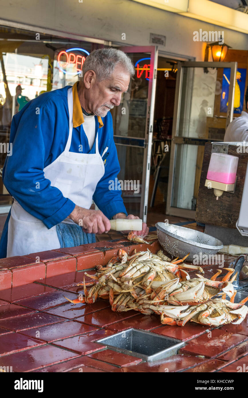 FISHERMANS WHARF Dungeness crab being cracked and prepared alfresco at