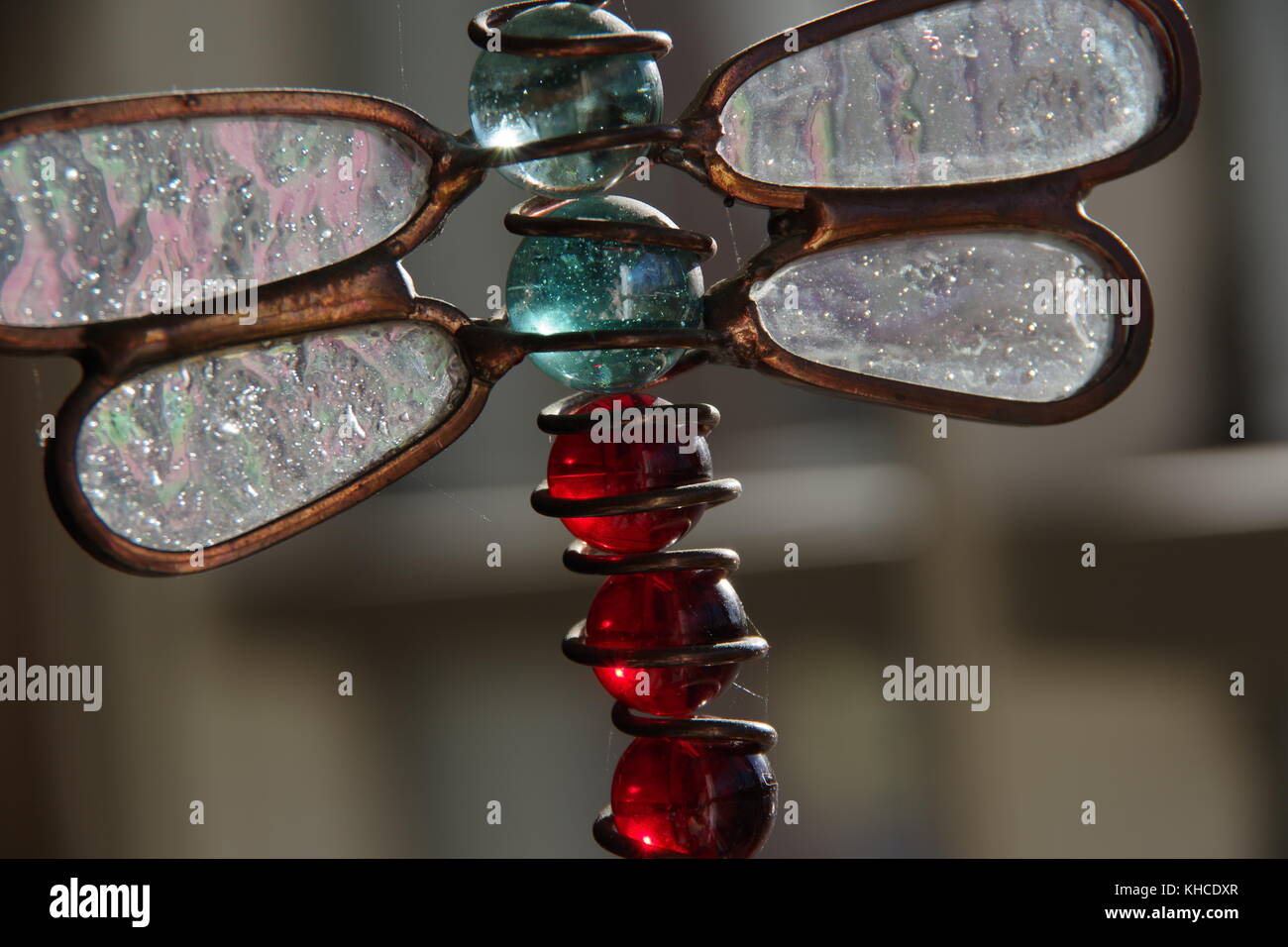 Close-ups of unique suspended glass and wire art. Stock Photo