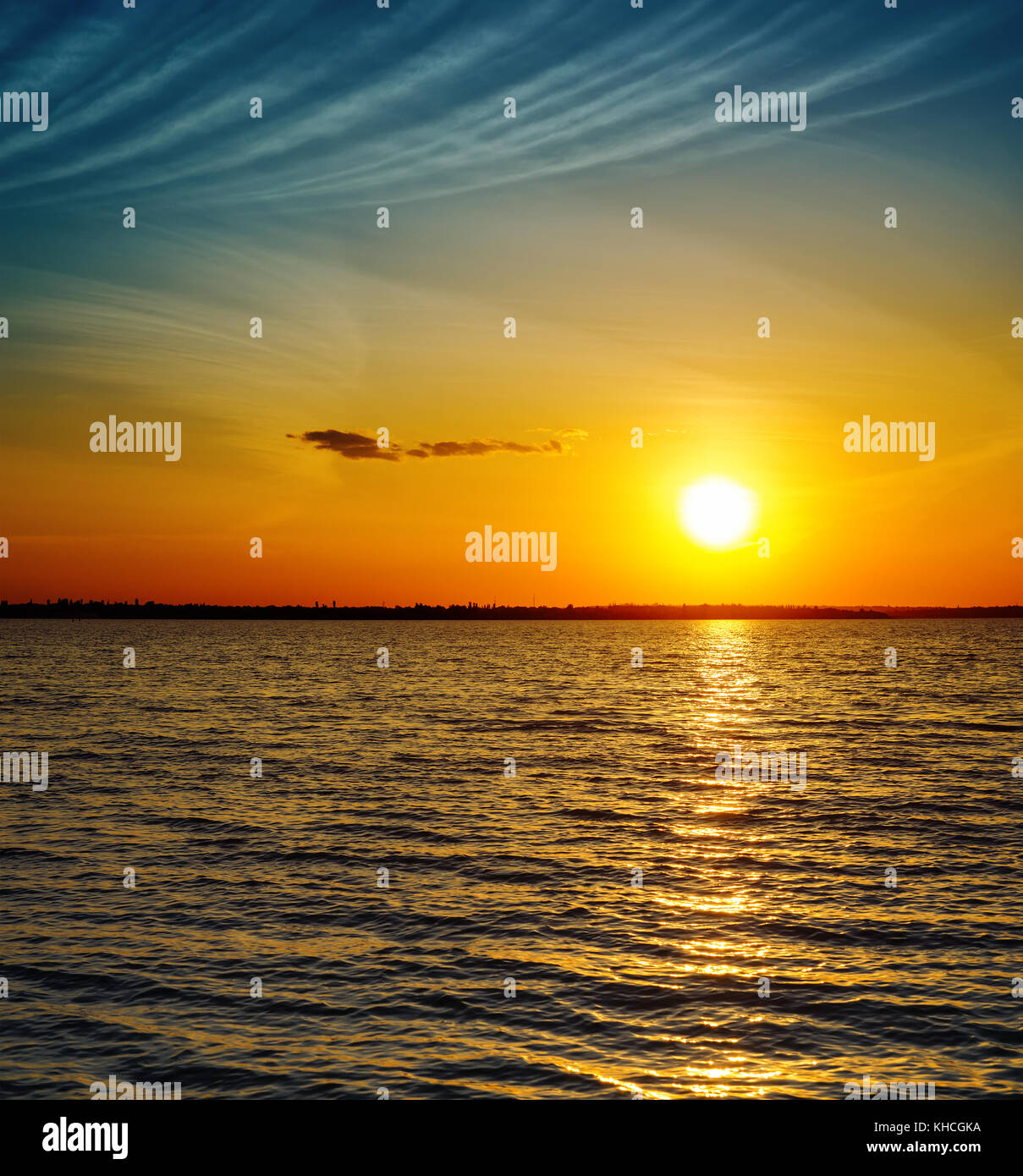 golden sunset over dark water Stock Photo - Alamy