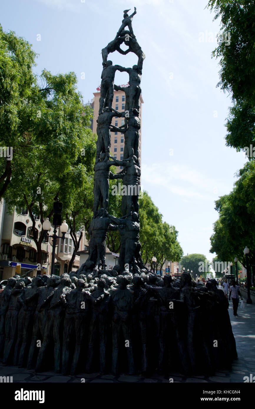 TARRAGONA, SPAIN - AUG 28th, 2017: statue of people making human towers, a traditional spectacle in Catalonia called castellers, with people climbing and making high structures Stock Photo