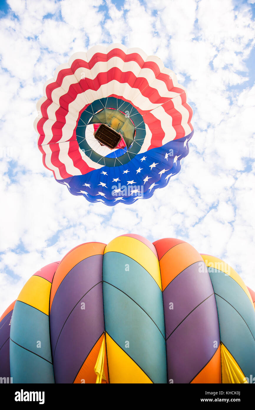 Hot air balloons in blue cloudy sky Stock Photo - Alamy