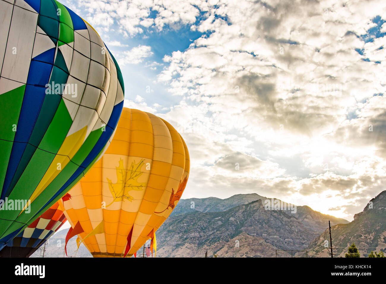 Hot air balloons in blue cloudy sky Stock Photo - Alamy