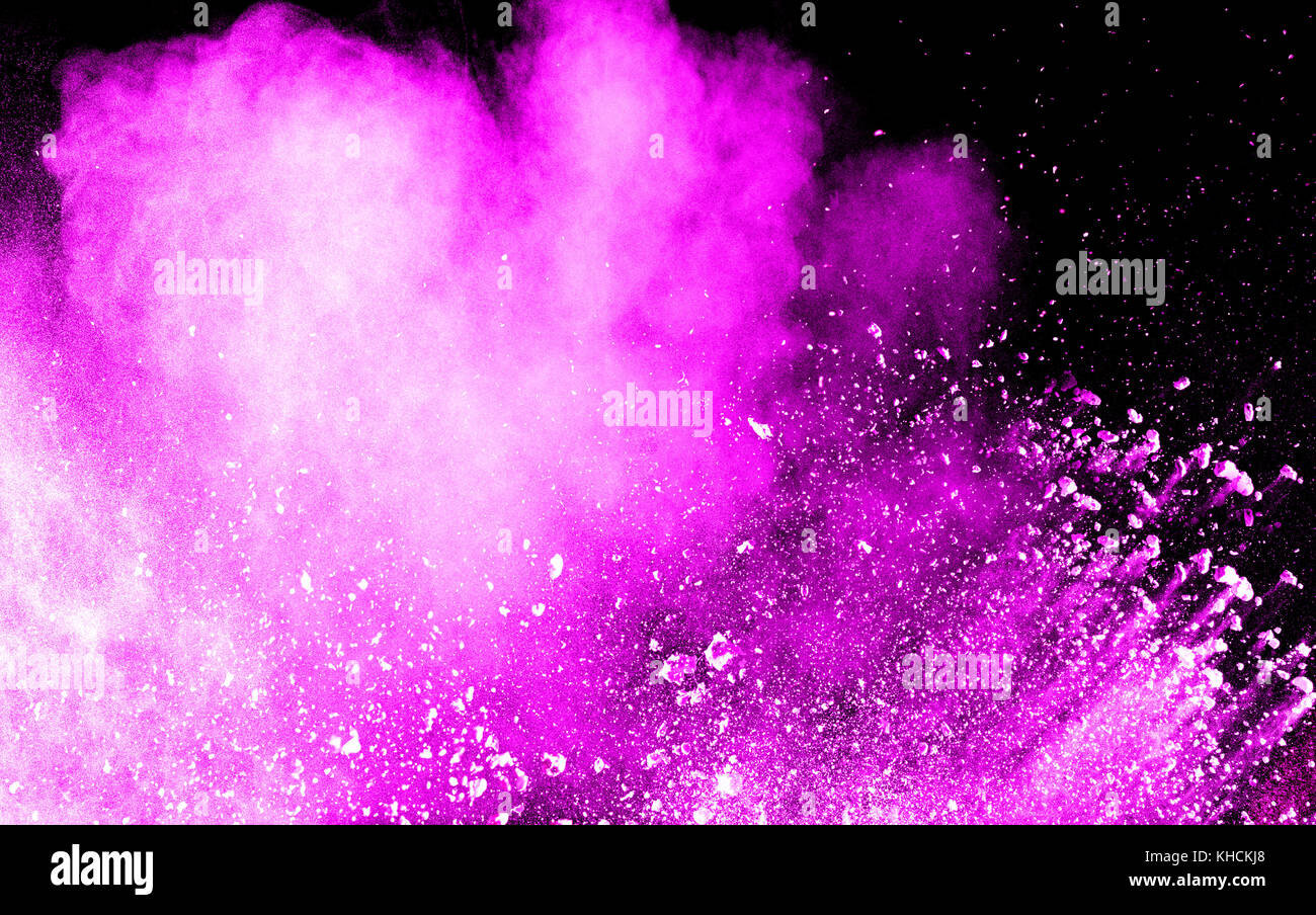 Pink dust particles splash on black background Stock Photo - Alamy