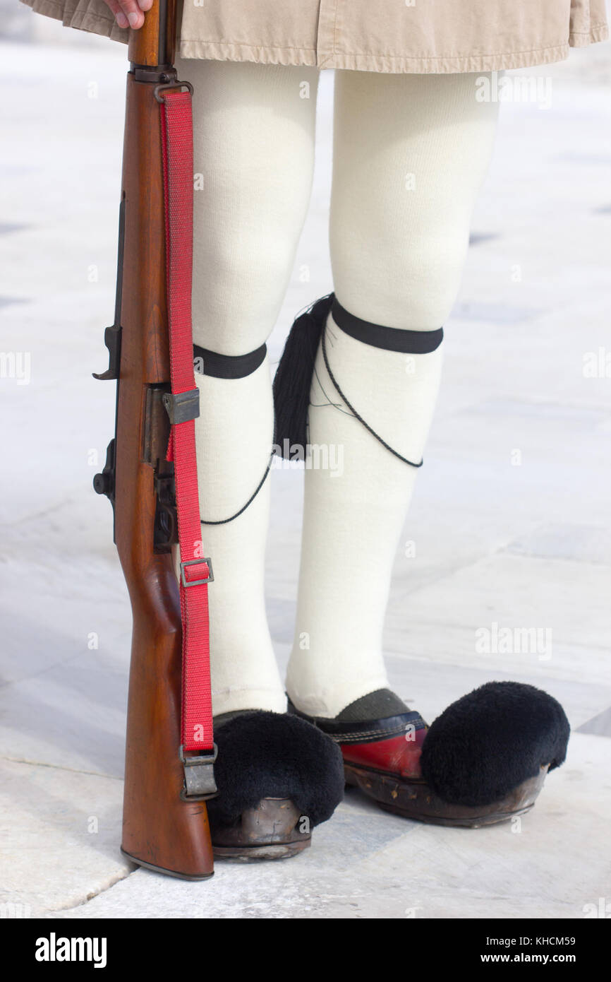 closeup of the the legs of the Greek Presidential guard called Tsoliades dressed in traditional uniform at the monument of the unknown soldier in fron Stock Photo