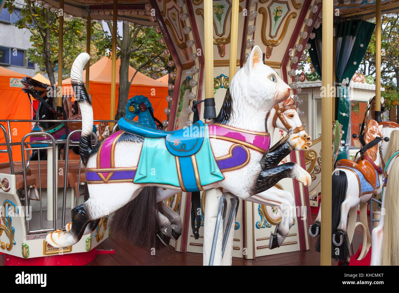 Fun colourful running cat kids ride on a Bertazzon Carousel at an ...