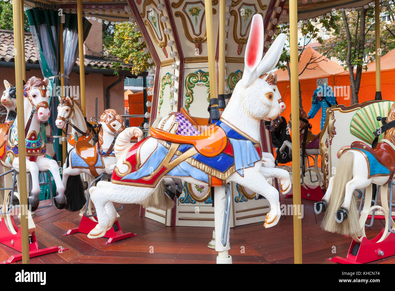 Colorful prancing rabbit ride on an Italian Bertazzon carousel or merry ...