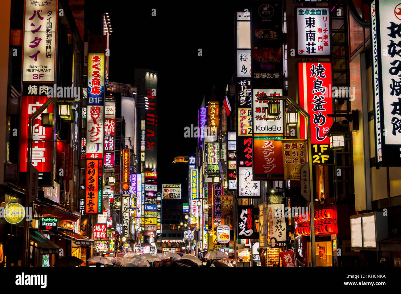 Kabukicho pass illuminated at night in Shinjuku district, Tokyo. The area is a commercial an entertainment zone Stock Photo