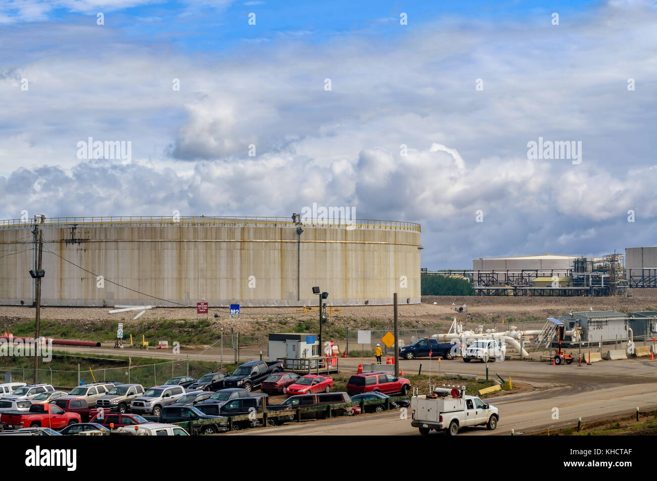 oil storage tanks and parking in the front, blue sky and clouds Stock Photo