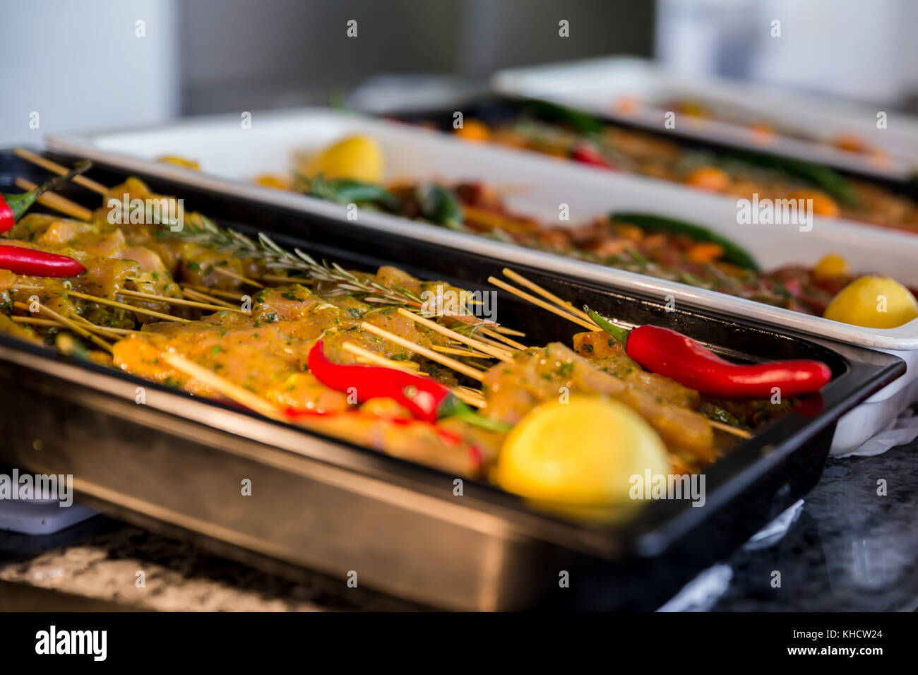 Chicken and turkey in skewers ready for barbecue on a 5 stars hotel buffet Stock Photo
