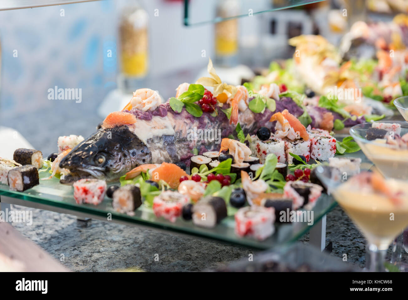 Asian food buffet in a hotel, california rolls and fish Stock Photo