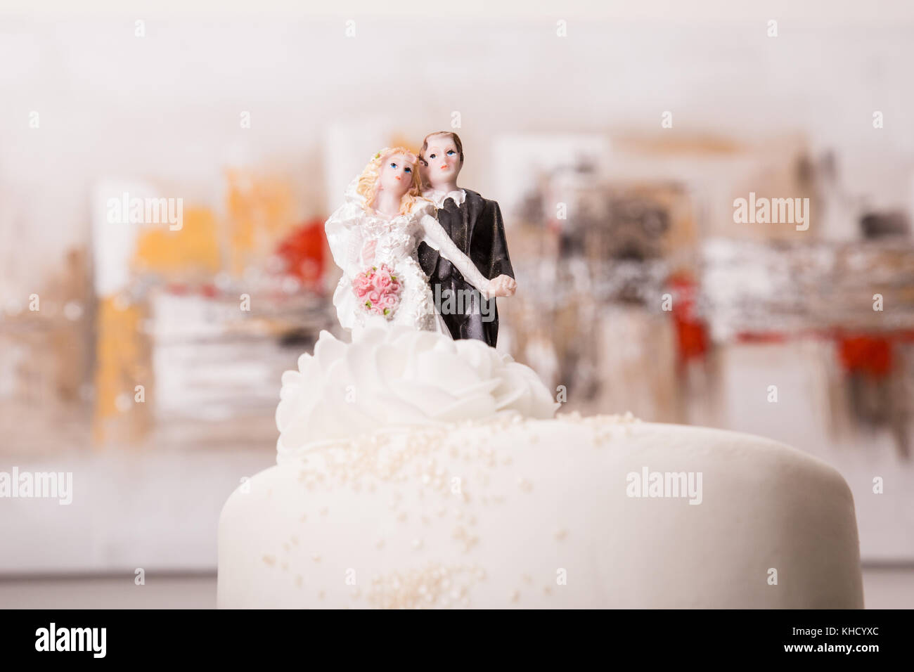 Marial decoration of husband and wife on top of a wedding cake Stock Photo