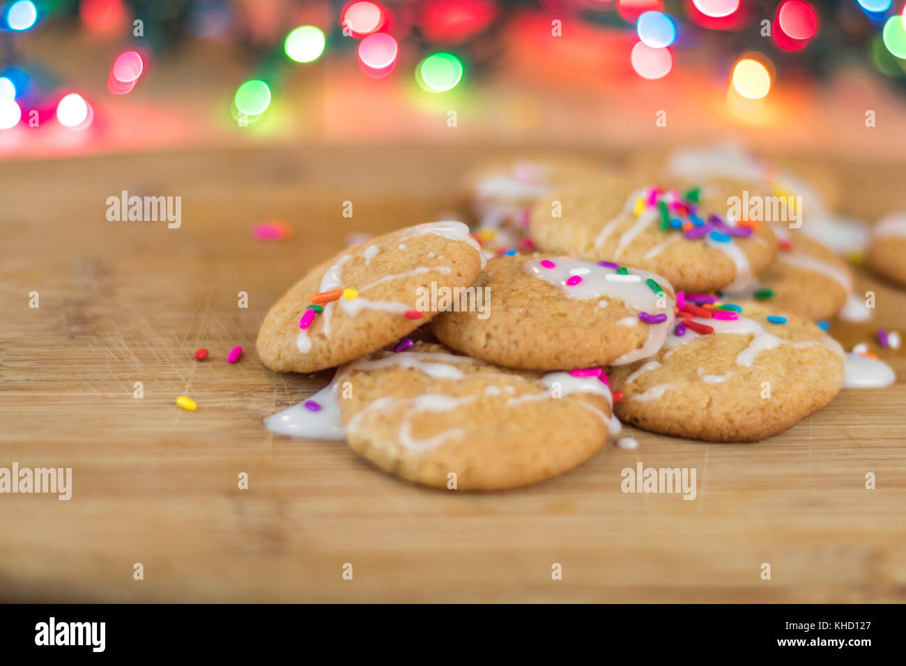 Freshly baked sugar cookies with white icing and rainbow colored