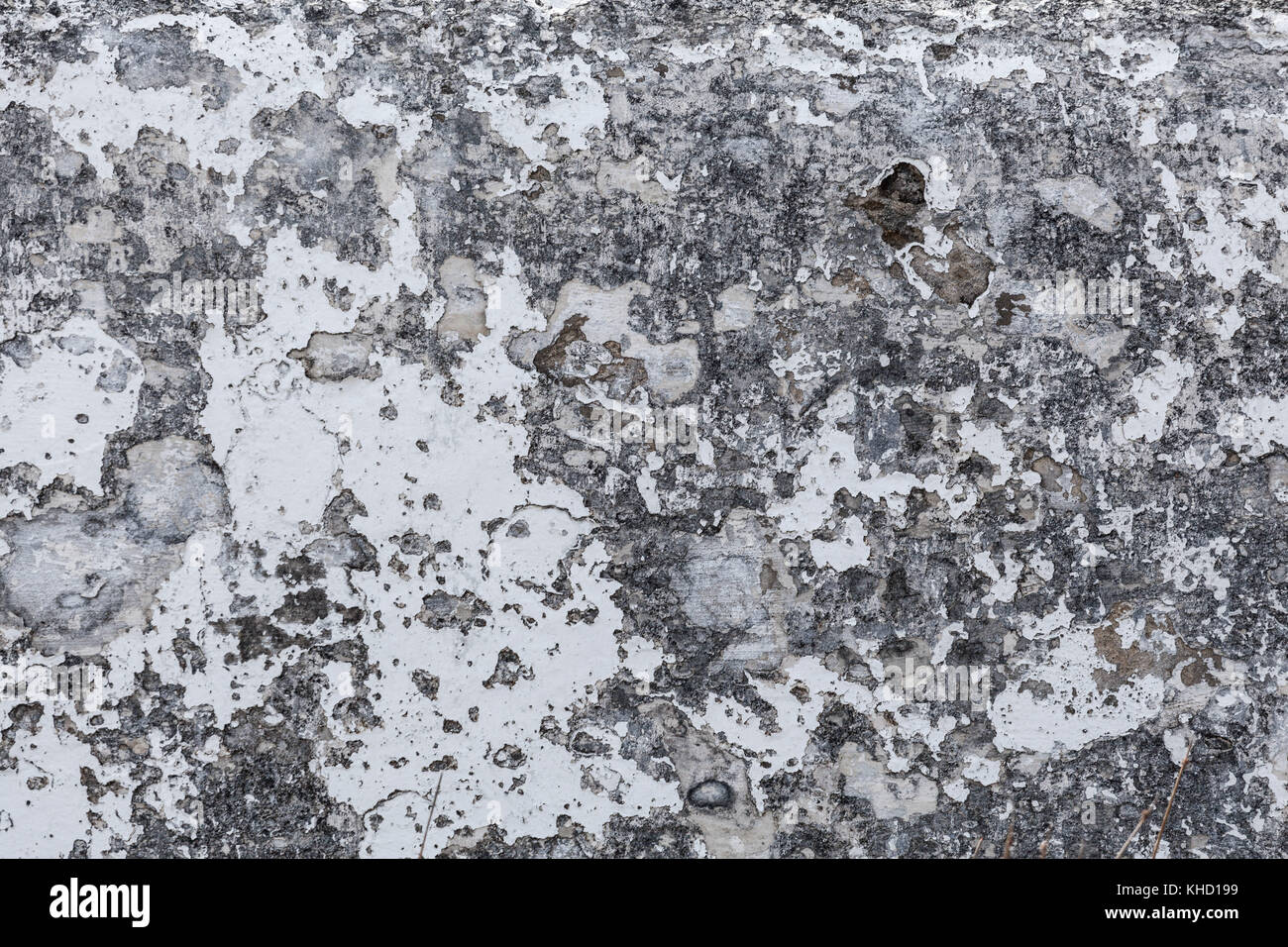 Grungy stone cement surface with peeling white paint background texture Stock Photo