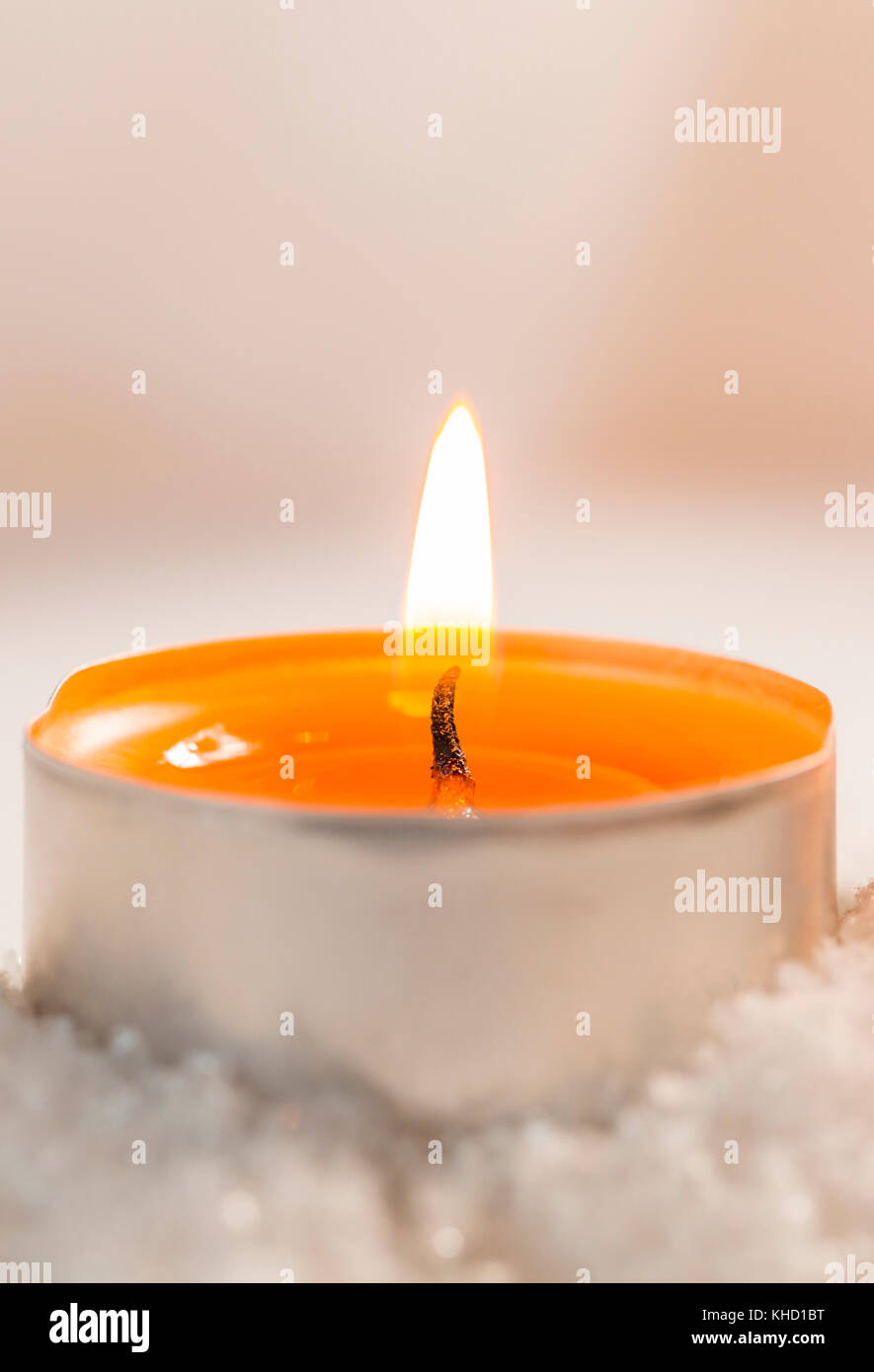 burning tealights in snow with soft background Stock Photo Alamy