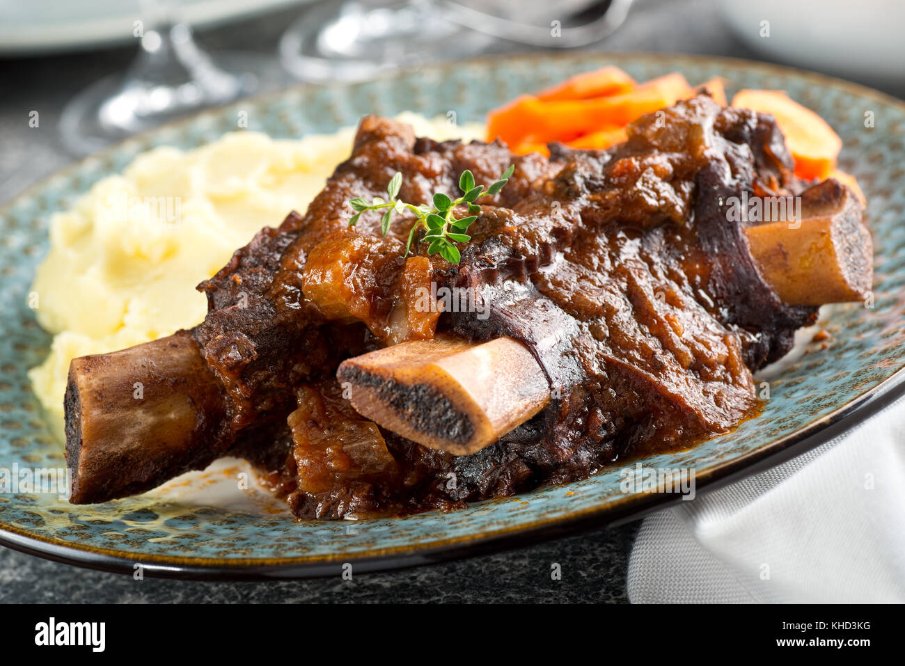 Delicious braised beef ribs with mashed potato and carrots. Stock Photo