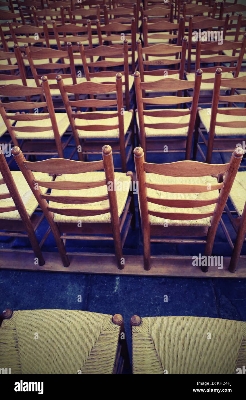background so many wooden chairs in the place of worship before the ...