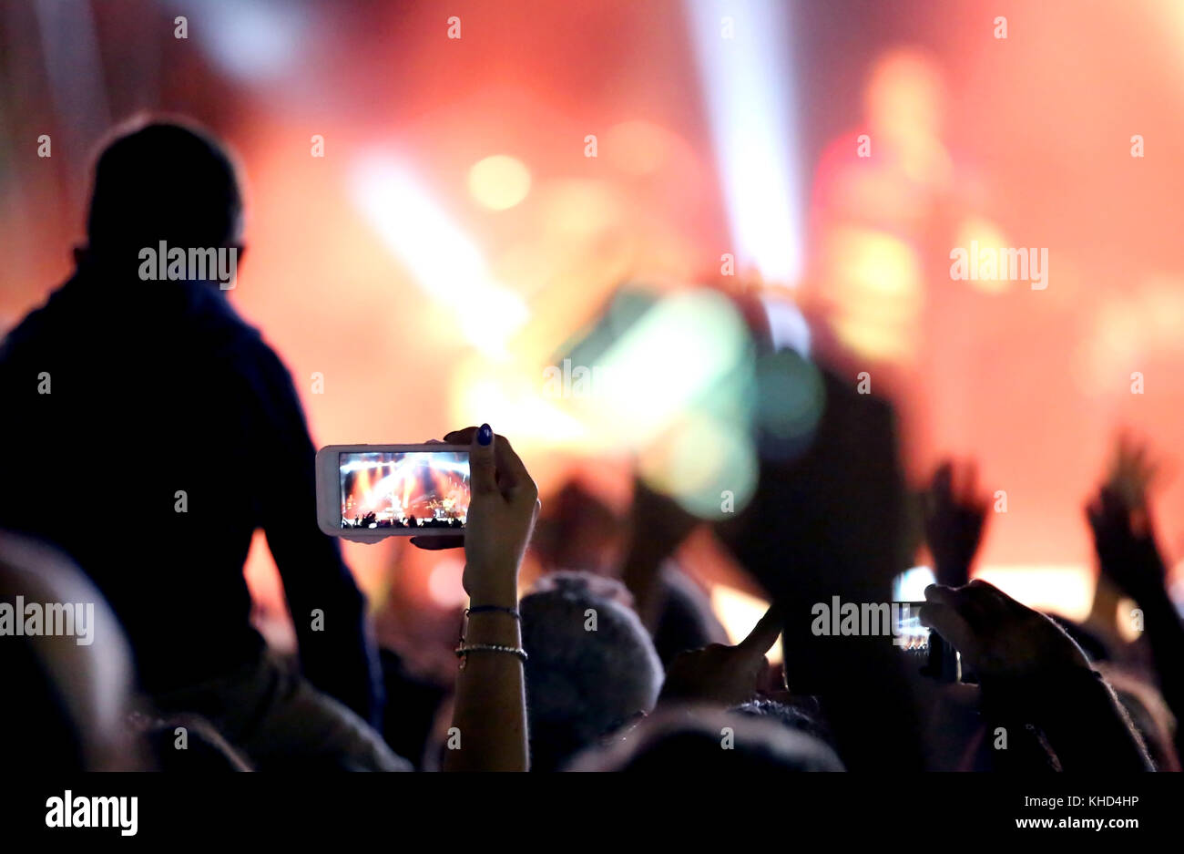 Concert Fans Camera fans who take photos and record videos with modern smartphones during ...