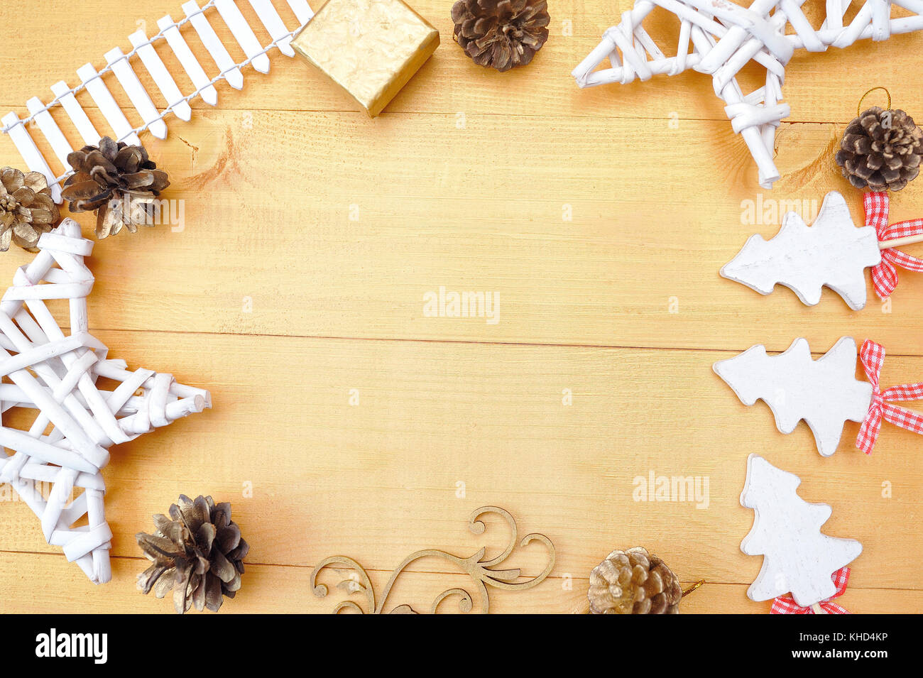 Christmas background with place for your text and white christmas tree and star on a gold wooden background. Flat lay, top view photo mockup Stock Photo